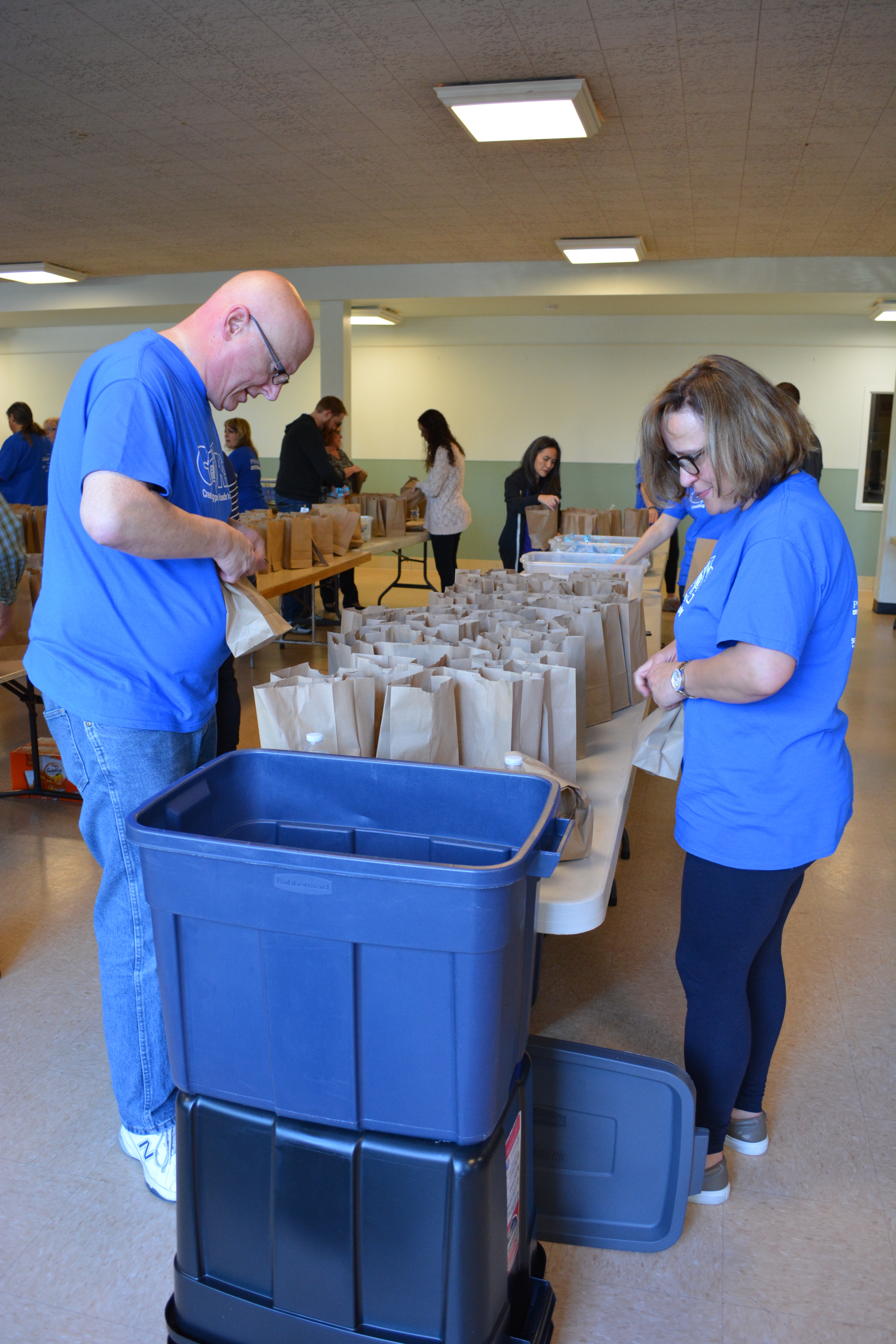 Volunteers packing snack kits for Washington Kids in Transition CORRECTED